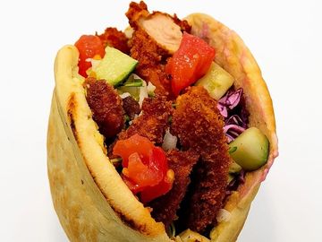 Crispy schnitzel pita combo with fries, salad, or soup plus a drink — full flavor, great value!
