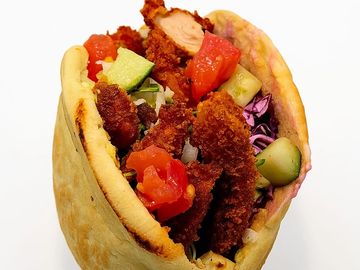 Crispy half-size schnitzel tucked in fresh pocket pita with salads and sauces. Perfect combo.