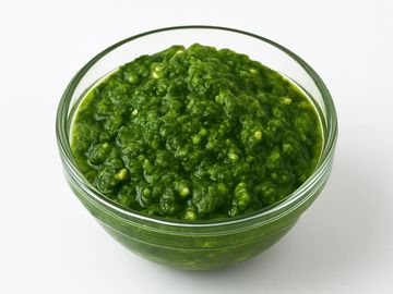 A bold, spicy Yemenite-style green chili sauce bursting with fresh herbs, garlic, and warm spices. 