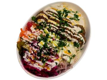 Crispy falafel bowl with fresh veggies and tahini. A flavour packed Mediterranean plant based.