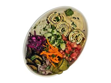 Fresh vegetable omelet bowl with hummus, Israeli salads and pickles in Winnipeg. fries and a drink.