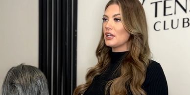 Ella our hair extension specialist, educator and trainer teaching a hair extension training course
