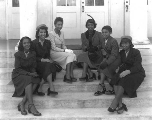 Group of girls sitting on steps at Middleton Senior High School : Tampa, Fla. 1952