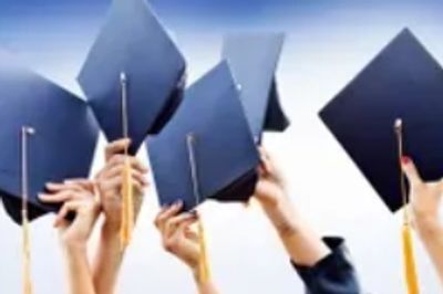 Graduating Students with Caps in the Air