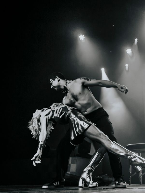 Dance performance with dramatic pose on stage.