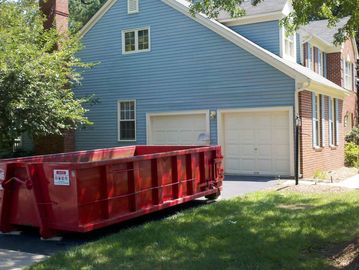 10 yd roll off dumpster in a customers driveway