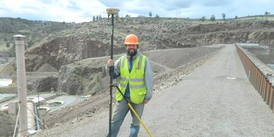 A land surveyor measuring the Iron Gate dam on the Klamath River