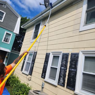 Gutter cleaning with a telescopic pole.