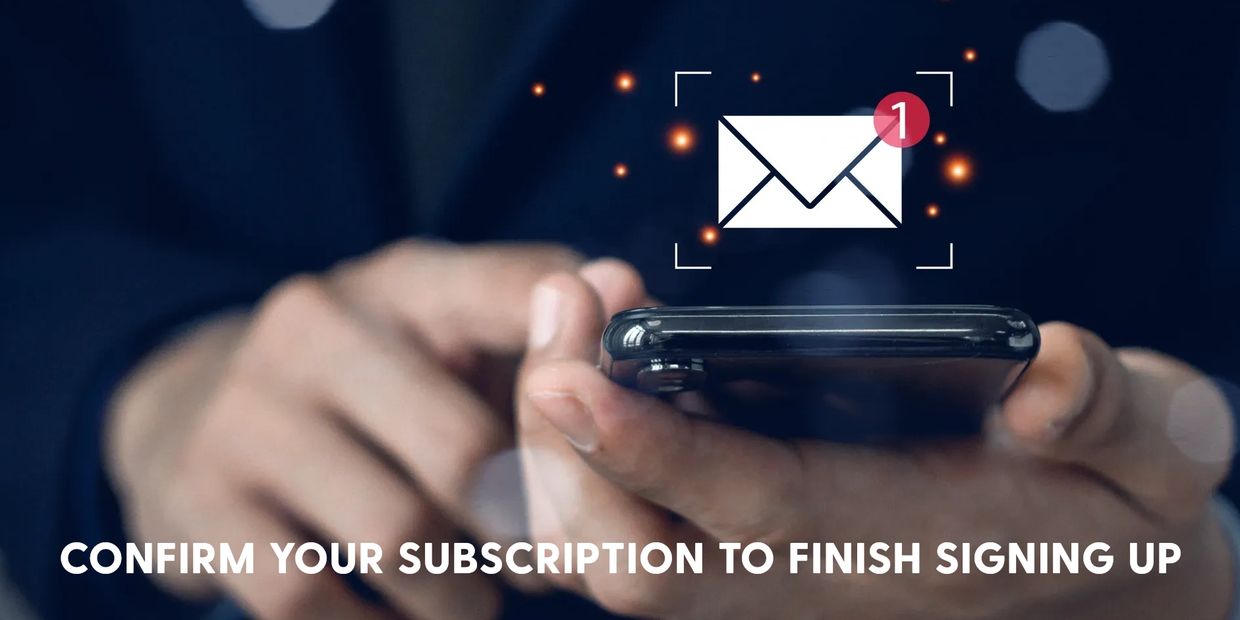 Person holding phone with email notification and subscription confirmation text.