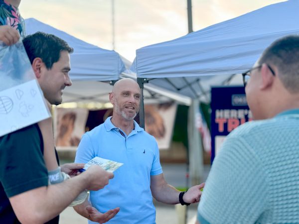 Speaking with people from the community at the Vietnamese Lunar Festival 2025 in our district.