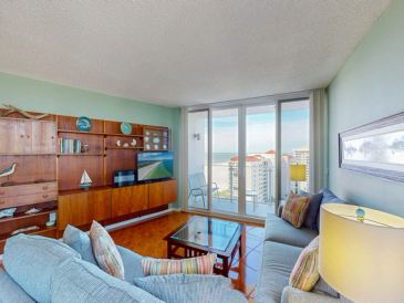 Cozy living room with ocean view and modern decor.