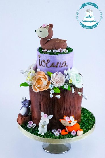 forest theme cake with edible animals