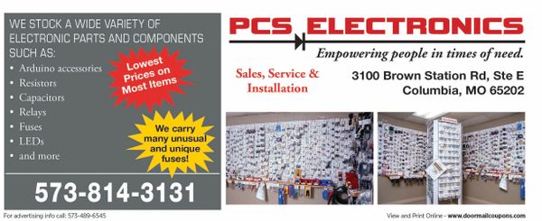 Storefront sign of PCS Electronics advertising electronic parts and services.