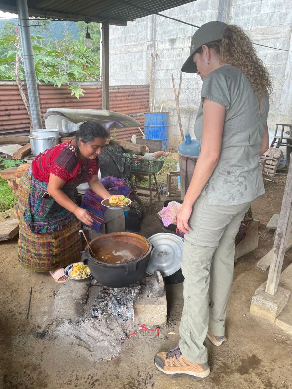 Women cooking in outdoor kitchen