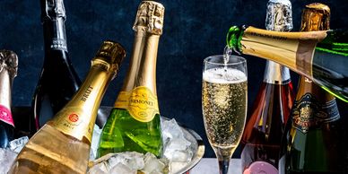 Champagne bottles and glasses with sparkling wine.
