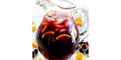 Pitcher of iced sangria with fruit.