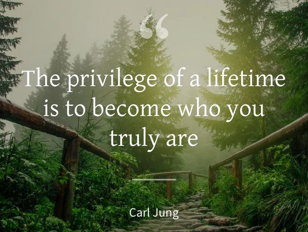 A misty forest path with a Carl Jung quote about self-discovery.