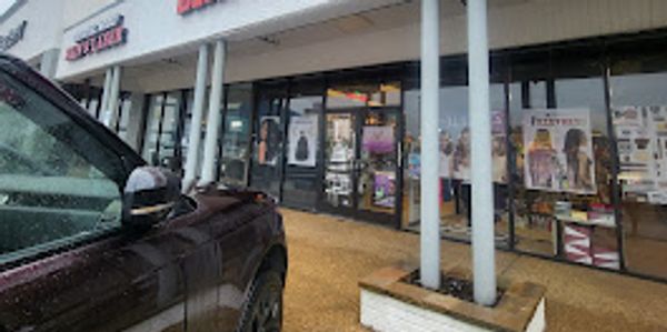 Exterior view of a Beauty Supply store in a shopping plaza.
