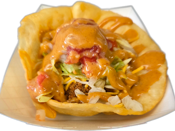 A loaded taco with sauce and toppings.