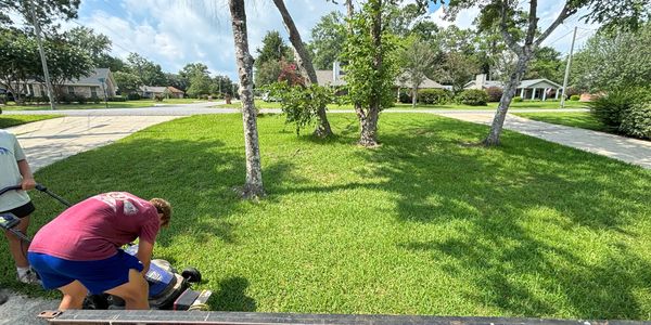 Mowing a lawn with employees 