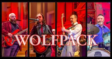 Four musicians performing live with "WOLFPACK" text overlay.