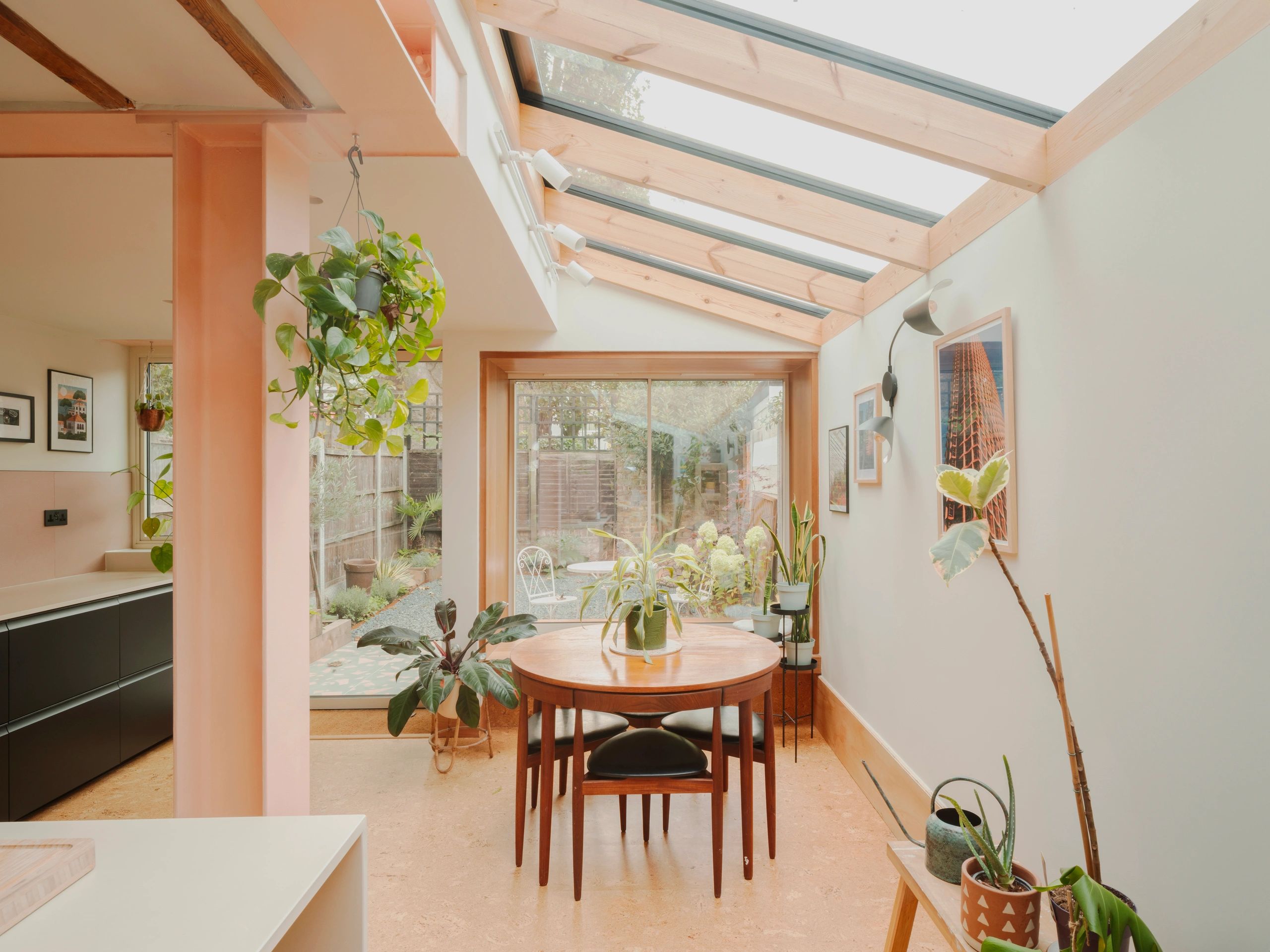 Dining area with skylights and indoor plants. Essex and London Construction trusted builders.