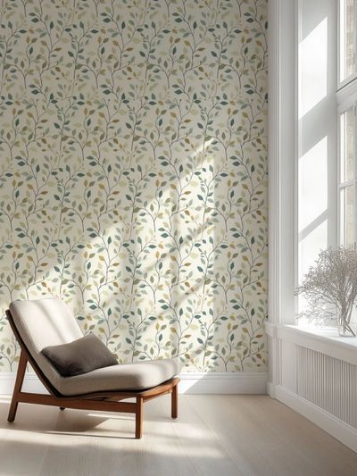 Chair in front of window with sun coming through and leafy wallpaper as backdrop