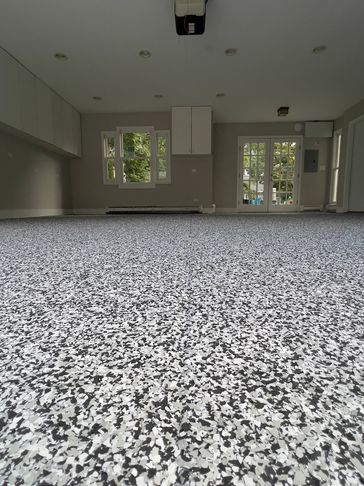 Garage epoxy flooring with gray vinyl flake system installed in Chicago home