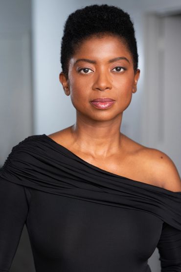 Confident woman in black off-shoulder top