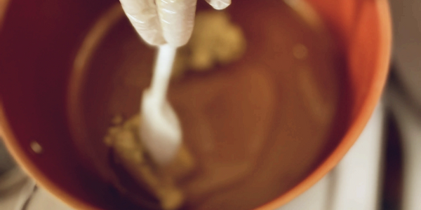 The process of mixing a body butter. (Grounded 1 oz.)