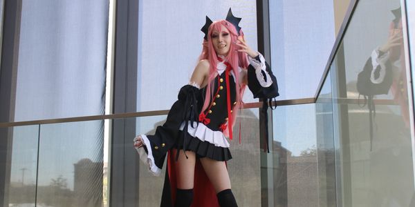 A woman in a costume poses for the camera.