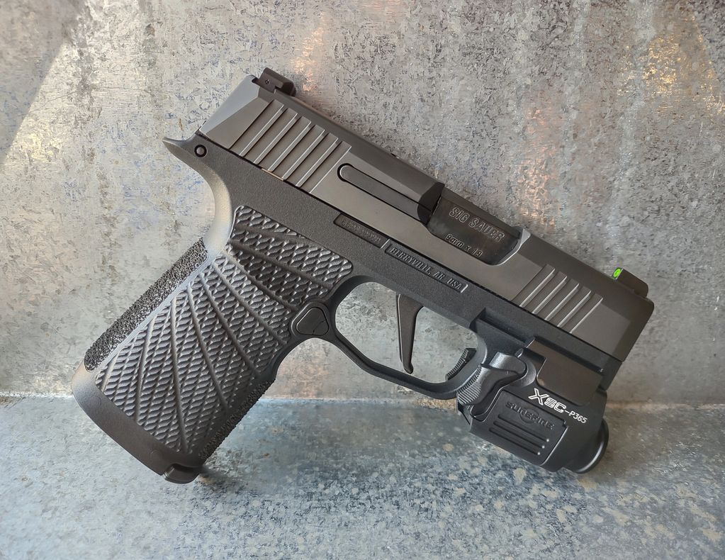 P365 with Wilson Combat Grip and Surefire XSC