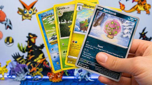 Person holding Pokémon trading cards, highlighting a collection for sale in Hagerstown, MD.