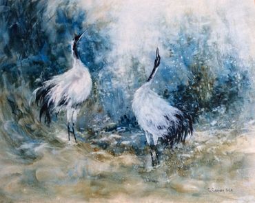 Two elegant white cranes standing in a misty, blue-hued landscape.