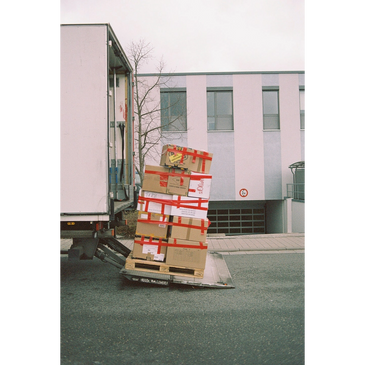 A team of movers hauling boxes