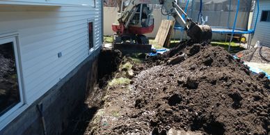 Exterior Waterproofing, Digging around the exterior of basement foundation.