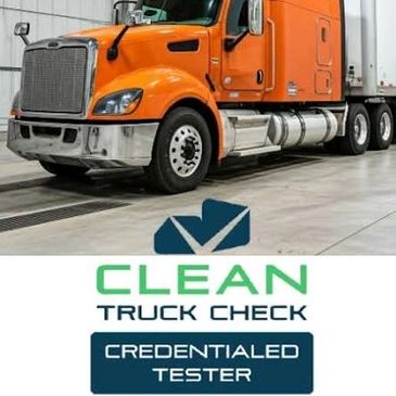 Orange semi-truck inside a warehouse with Clean Truck Check logo.