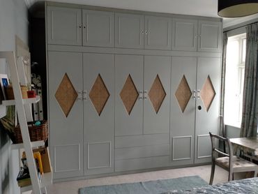 Fitted wardrobes with bespoke diamond rattan doors and oak veneer interior, NW10