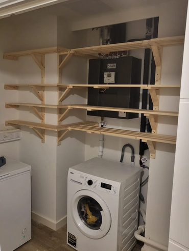Pine slatted shelves made and fitted in utility room