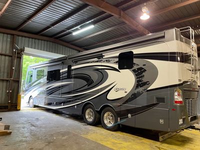2020 Fleetwood Discovery LXE inside the shop for RV service and ceramic coating