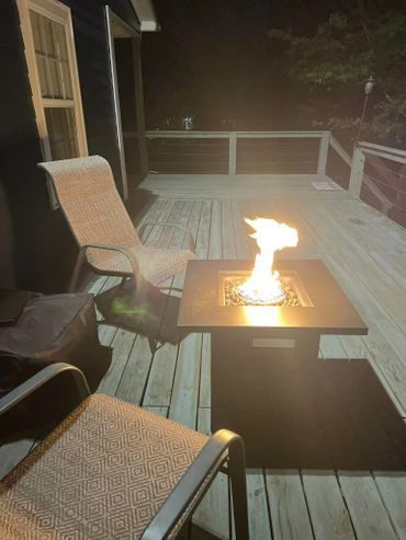 Enjoy a cozy fire while sipping your favorite beverage on the deck at Cabin in the Heart of Pickwick.