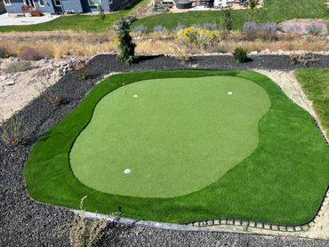 Three hole putting green.