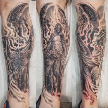 Detailed tattoo of a warrior with a lion and shield in a smoky background.