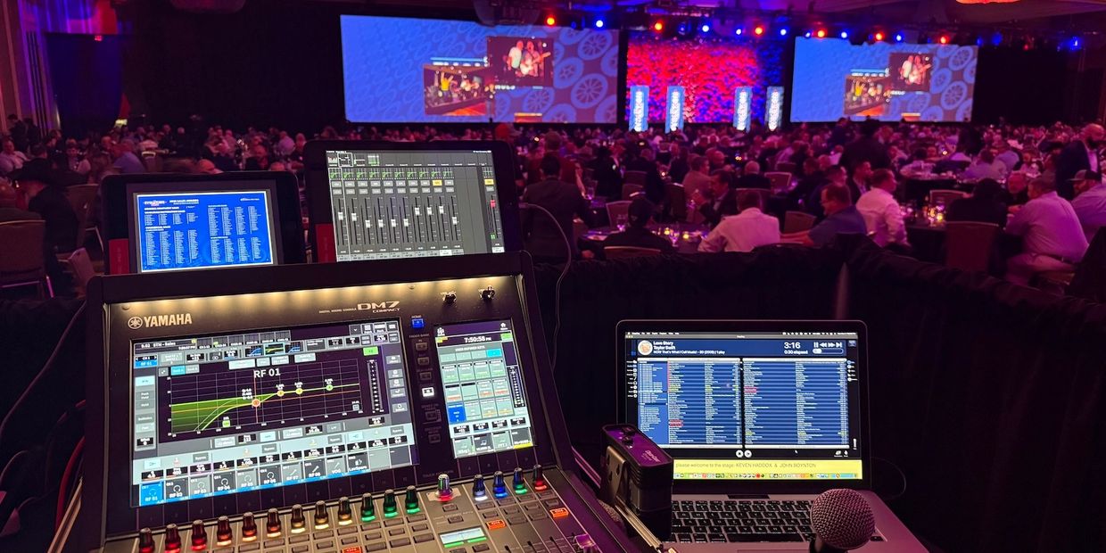 Yamaha DM7 mixer view at a beautifully lit Hilton Anatole event for professional corporate AV mixing