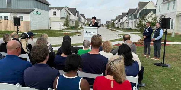 Press conference in McKinney with podium, stage, and a battery-powered PA system for event audio.