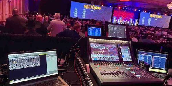 Yamaha DM7 view at a Hurst–Euless–Bedford event showcasing 24 wireless mics with zero dropouts.