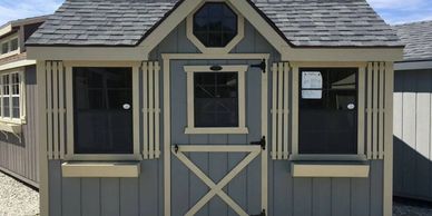 Want a little more style in your yard? The centered gable dormer with a stylish octagon window make 