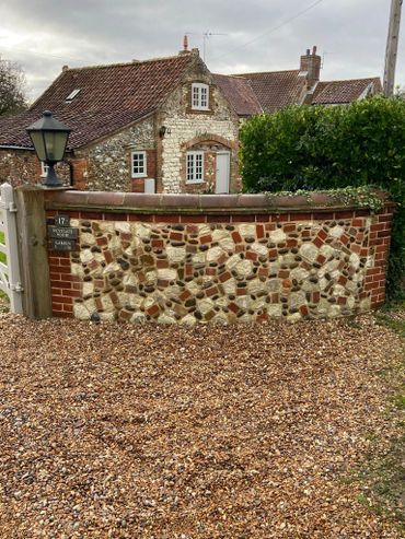 Flint and chalk wall with brick detail