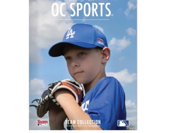 Young baseball player in blue uniform ready to pitch.