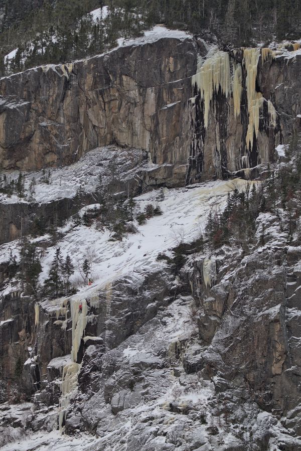 Jean-Francois Girard and Stas climbing the first ice pitch the day they opened the line Jormungander